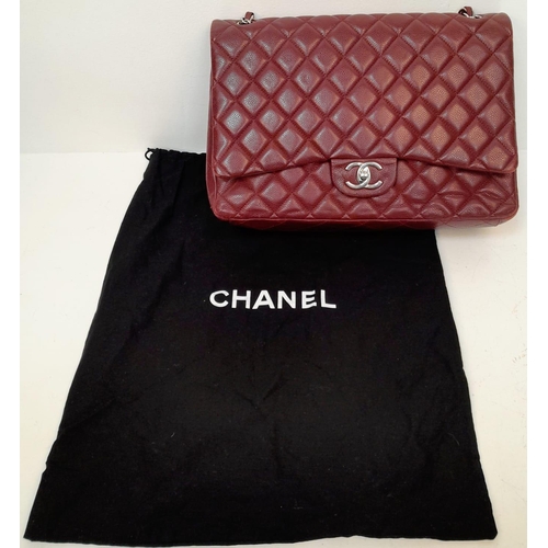 39 - A Chanel Burgundy Jumbo Classic Double Flap Bag. Quilted leather exterior with silver-toned hardware... 