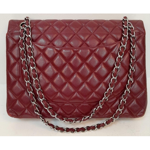 39 - A Chanel Burgundy Jumbo Classic Double Flap Bag. Quilted leather exterior with silver-toned hardware... 