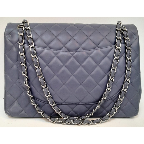 46 - A Chanel Jumbo Double Flap Maxi Bag. Blue quilted caviar leather exterior with a large slip pocket a... 