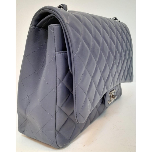 46 - A Chanel Jumbo Double Flap Maxi Bag. Blue quilted caviar leather exterior with a large slip pocket a... 