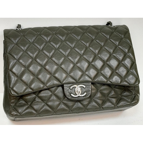 60 - A Chanel Green Jumbo Classic Double Flap Bag. Quilted leather exterior with silver-toned hardware, c... 