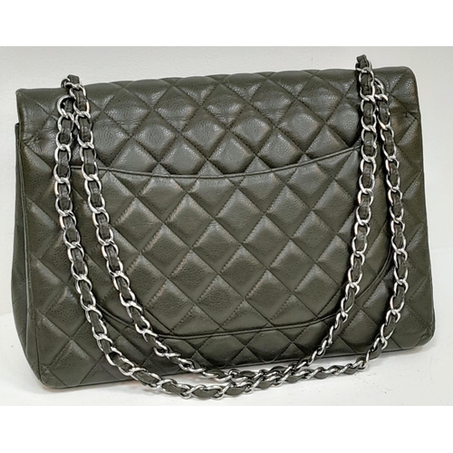 60 - A Chanel Green Jumbo Classic Double Flap Bag. Quilted leather exterior with silver-toned hardware, c... 