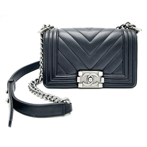 67 - A Chanel Black Leather Boy Bag. Chevron decorative soft black leather with an antique style/finish C... 