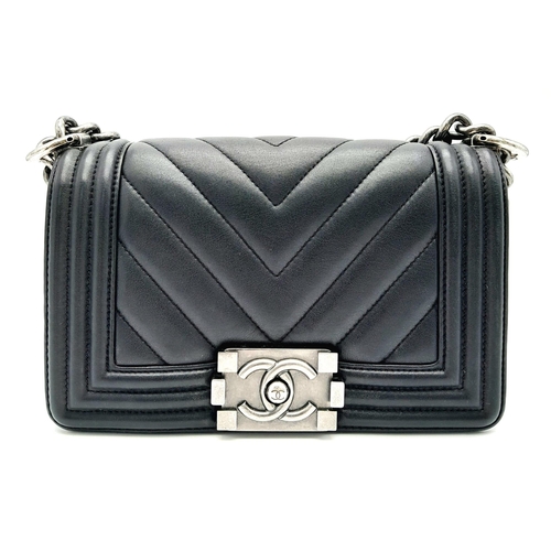 67 - A Chanel Black Leather Boy Bag. Chevron decorative soft black leather with an antique style/finish C... 