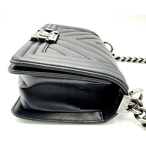 67 - A Chanel Black Leather Boy Bag. Chevron decorative soft black leather with an antique style/finish C... 