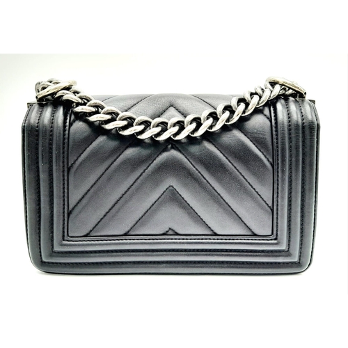 67 - A Chanel Black Leather Boy Bag. Chevron decorative soft black leather with an antique style/finish C... 