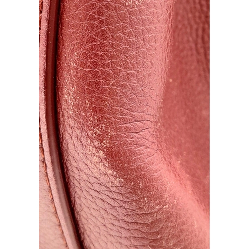 74 - A Chanel Neo Executive Leather Tote Bag. Burgundy leather exterior with gold tone hardware and two l... 