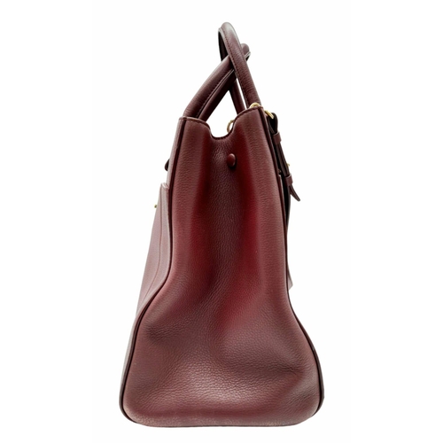 74 - A Chanel Neo Executive Leather Tote Bag. Burgundy leather exterior with gold tone hardware and two l... 