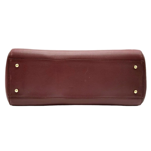 74 - A Chanel Neo Executive Leather Tote Bag. Burgundy leather exterior with gold tone hardware and two l... 