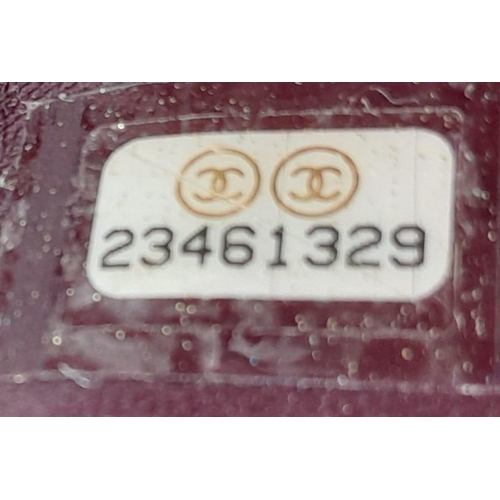 74 - A Chanel Neo Executive Leather Tote Bag. Burgundy leather exterior with gold tone hardware and two l... 