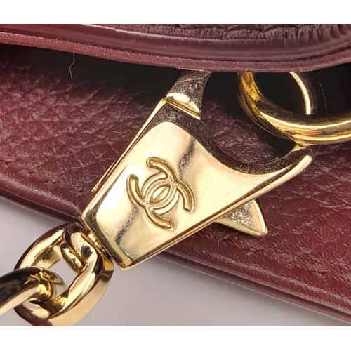 74 - A Chanel Neo Executive Leather Tote Bag. Burgundy leather exterior with gold tone hardware and two l... 