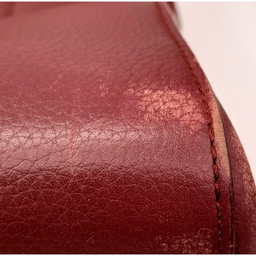 74 - A Chanel Neo Executive Leather Tote Bag. Burgundy leather exterior with gold tone hardware and two l... 