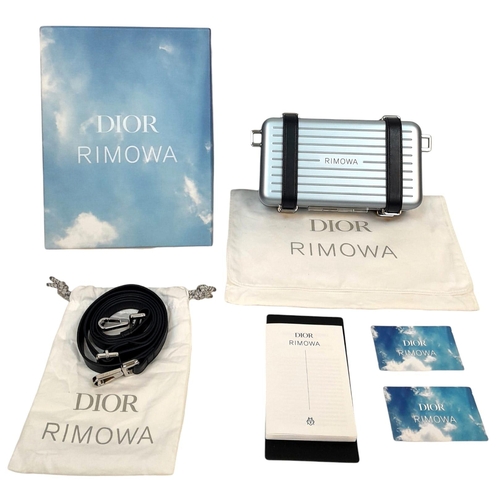 95 - A Christian Dior x Rimowa Collaboration Ice Blue Clutch Bag. Aluminium exterior with silver-toned ha... 