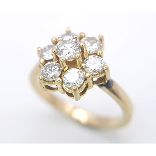 103 - AN 18K YELLOW GOLD DIAMOND CLUSTER RING. 1.20CTW OF ROUND BRILIANT CUT DIAMONDS. 3.9G. SIZE L.