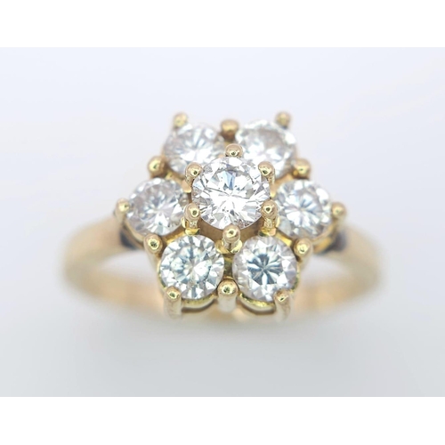 103 - AN 18K YELLOW GOLD DIAMOND CLUSTER RING. 1.20CTW OF ROUND BRILIANT CUT DIAMONDS. 3.9G. SIZE L.