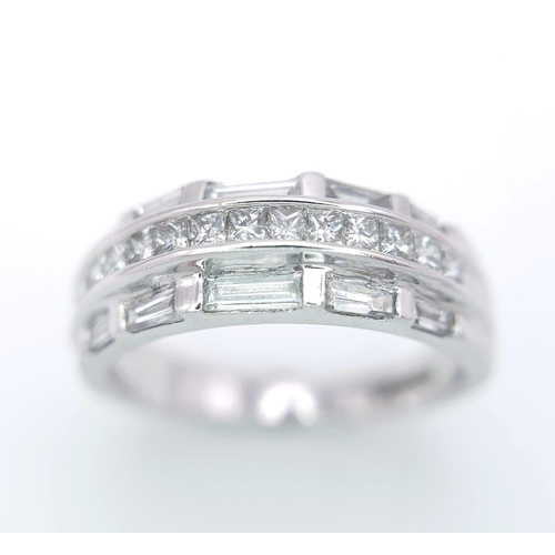 149 - AN 18K WHITE GOLD DIAMOND SET BAND RING - 3 ROWS OF 1CTW OF DIAMOND MIXTURE OF PRINCESS AND BAGUETTE... 