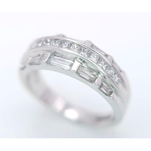 149 - AN 18K WHITE GOLD DIAMOND SET BAND RING - 3 ROWS OF 1CTW OF DIAMOND MIXTURE OF PRINCESS AND BAGUETTE... 