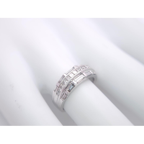 149 - AN 18K WHITE GOLD DIAMOND SET BAND RING - 3 ROWS OF 1CTW OF DIAMOND MIXTURE OF PRINCESS AND BAGUETTE... 