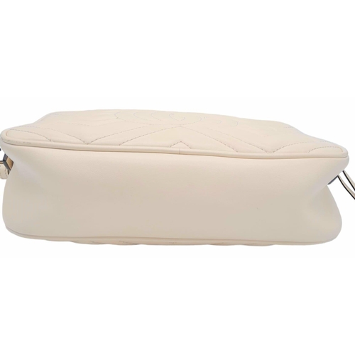 199 - A Gucci Ivory GG Marmont Cross Body Bag. Quilted leather exterior with gold-toned hardware, chain an... 