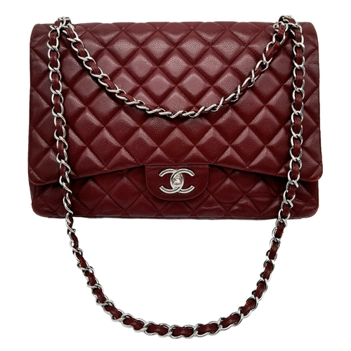 39 - A Chanel Burgundy Jumbo Classic Double Flap Bag. Quilted leather exterior with silver-toned hardware... 