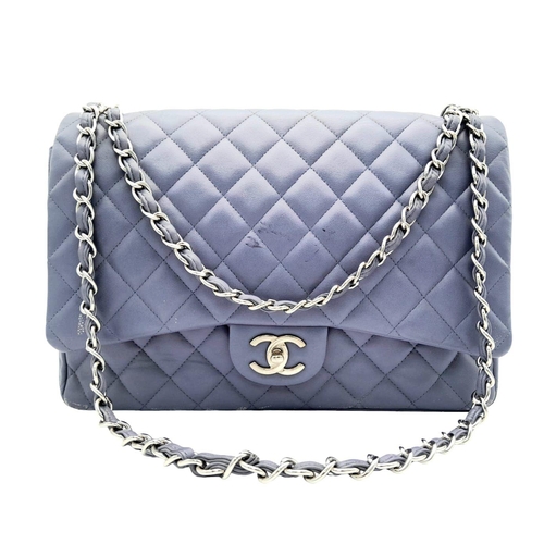 46 - A Chanel Jumbo Double Flap Maxi Bag. Blue quilted caviar leather exterior with a large slip pocket a... 