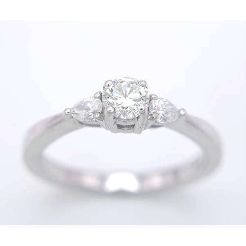 75 - AN 18K WHITE GOLD DIAMOND RING WITH PEAR SHAPED DIAMOND ACCENTS ON SHOULDERS. 0.40CTW OF PEAR SHAPED... 