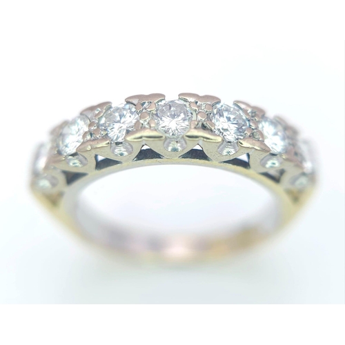 163 - An 18K Yellow Gold Diamond Half Eternity Ring. 0.70ctw, Size J1/2, 3.6g total weight. Ref: 8451