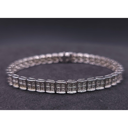 54 - A 9K White Gold Diamond Set Bracelet, with Under Safety Catch Fitting. 1ctw, 19cm length, 12.7g tota... 