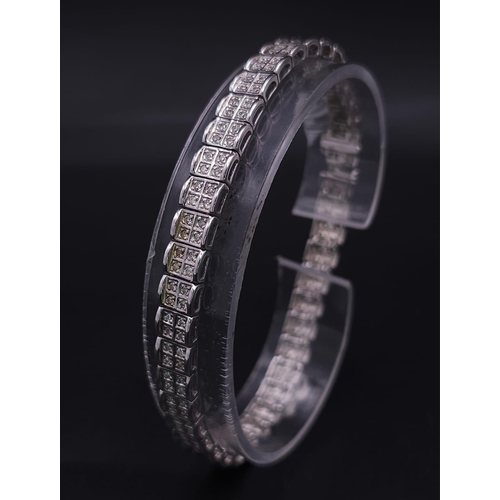 54 - A 9K White Gold Diamond Set Bracelet, with Under Safety Catch Fitting. 1ctw, 19cm length, 12.7g tota... 