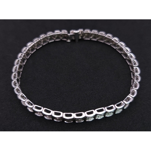 54 - A 9K White Gold Diamond Set Bracelet, with Under Safety Catch Fitting. 1ctw, 19cm length, 12.7g tota... 