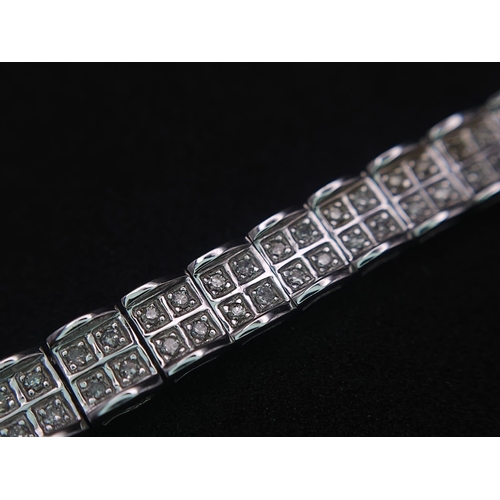 54 - A 9K White Gold Diamond Set Bracelet, with Under Safety Catch Fitting. 1ctw, 19cm length, 12.7g tota... 