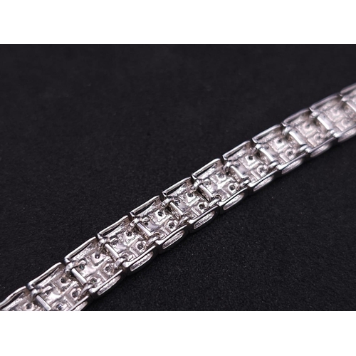 54 - A 9K White Gold Diamond Set Bracelet, with Under Safety Catch Fitting. 1ctw, 19cm length, 12.7g tota... 