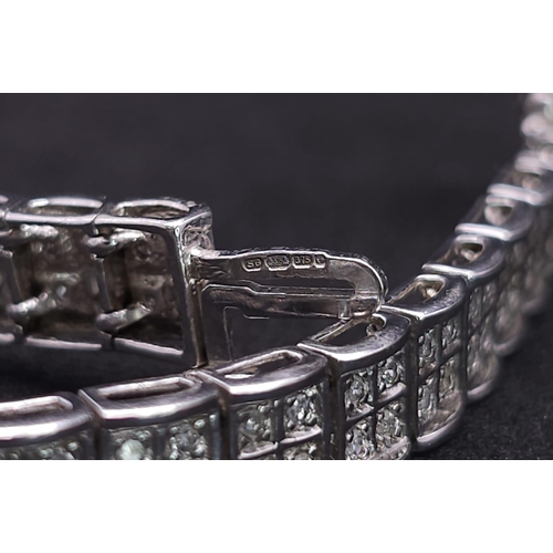 54 - A 9K White Gold Diamond Set Bracelet, with Under Safety Catch Fitting. 1ctw, 19cm length, 12.7g tota... 