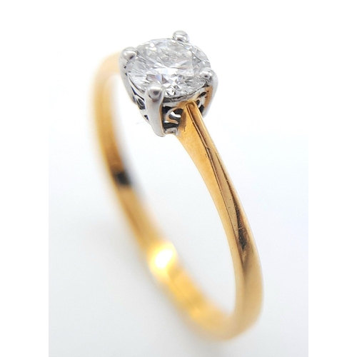 165 - AN 18K YELLOW GOLD DIAMOND SOLITAIRE RING. ROUND BRILLIANT CUT 0.30CT DIAMOND IN A 4 CLAW SETTING. 1... 