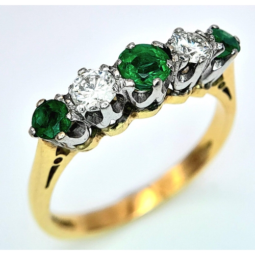 193 - AN 18K YELLOW GOLD DIAMOND & EMERALD RING. 0.20CTW DIAMONDS. 3.3G. SIZE N.