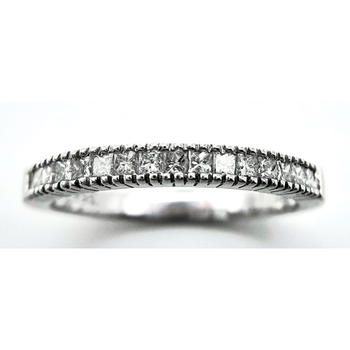 207 - AN 18K WHITE GOLD DIAMOND SET BAND RING - PRINCESS CUTS. 0.50CTW. 2.8G. SIZE P 1/2.