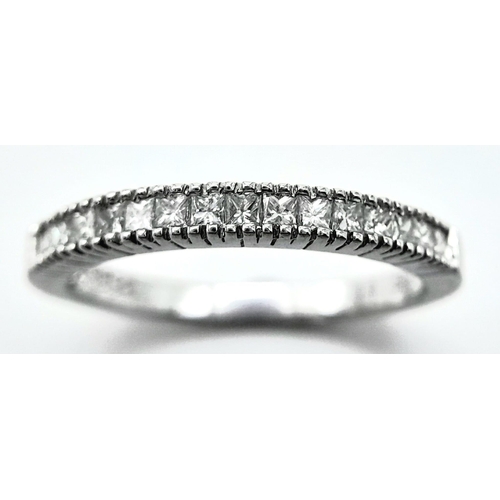 207 - AN 18K WHITE GOLD DIAMOND SET BAND RING - PRINCESS CUTS. 0.50CTW. 2.8G. SIZE P 1/2.