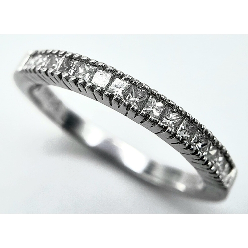 207 - AN 18K WHITE GOLD DIAMOND SET BAND RING - PRINCESS CUTS. 0.50CTW. 2.8G. SIZE P 1/2.