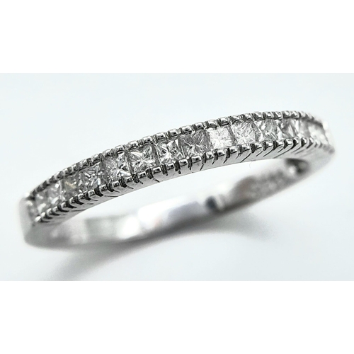 207 - AN 18K WHITE GOLD DIAMOND SET BAND RING - PRINCESS CUTS. 0.50CTW. 2.8G. SIZE P 1/2.