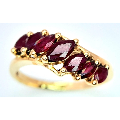 246 - A 14K YELLOW GOLD GARNET SET RING. 2.6G. SIZE K.