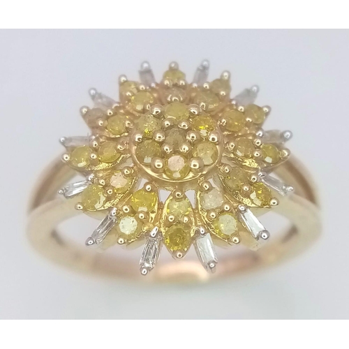 249 - A 9K YELLOW GOLD,  WHITE AND YELLOW DIAMOND SET CLUSTER RING. 3.3G. SIZE L 1/2. A MIXTURE OF ROUND A... 