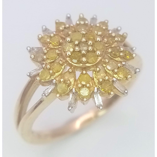 249 - A 9K YELLOW GOLD,  WHITE AND YELLOW DIAMOND SET CLUSTER RING. 3.3G. SIZE L 1/2. A MIXTURE OF ROUND A... 