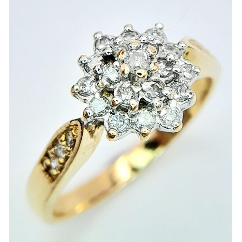 268 - AN 18K YELLOW GOLD DIAMOND SET CLUSTER RING. 0.33CT. 3.7G. SIZE M.