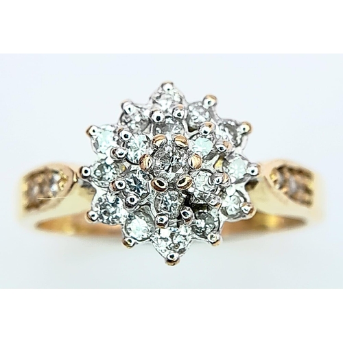 268 - AN 18K YELLOW GOLD DIAMOND SET CLUSTER RING. 0.33CT. 3.7G. SIZE M.