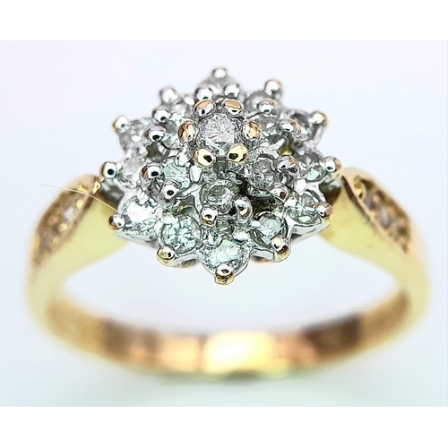 268 - AN 18K YELLOW GOLD DIAMOND SET CLUSTER RING. 0.33CT. 3.7G. SIZE M.