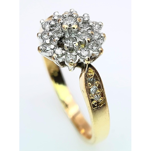 268 - AN 18K YELLOW GOLD DIAMOND SET CLUSTER RING. 0.33CT. 3.7G. SIZE M.