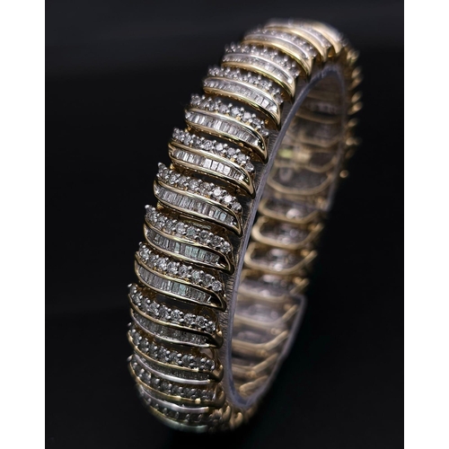 5 - A BEAUTIFUL  HEAD-TURNING 14K YELLOW GOLD DIAMOND TENNIS BRACELET WITH A MIXTURE OF ROUND AND BAGUET... 