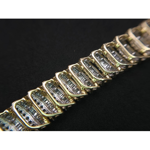 5 - A BEAUTIFUL  HEAD-TURNING 14K YELLOW GOLD DIAMOND TENNIS BRACELET WITH A MIXTURE OF ROUND AND BAGUET... 