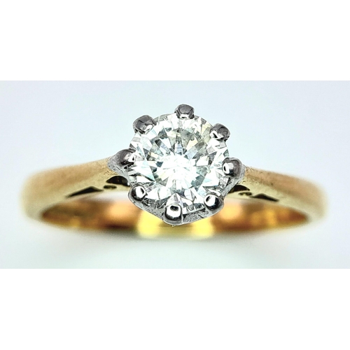 82 - AN 18K YELLOW GOLD DIAMOND SOLITAIRE RING - 0.65CT. 8 CLAW SETTING. 3.4G. SIZE L.