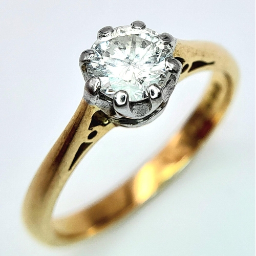 82 - AN 18K YELLOW GOLD DIAMOND SOLITAIRE RING - 0.65CT. 8 CLAW SETTING. 3.4G. SIZE L.